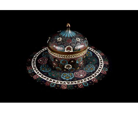 An interesting 19th century Middle Eastern covered cup on stand, the gilt copper base with champleve style enamel supporting 