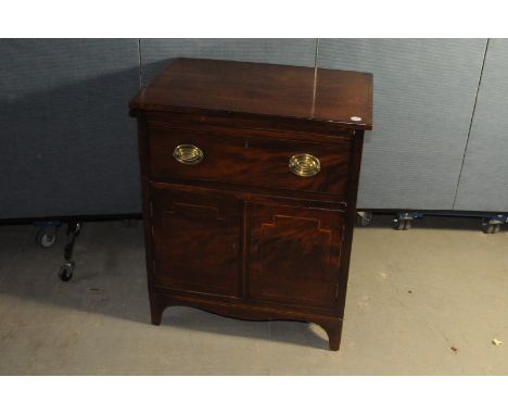 A George III period mahogany converted commode, having brass handles and inlay to doors