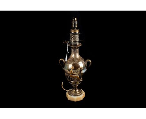 An early 20th century silver plated table lamp, by Miller & Co, in the classical taste, decorated with a classical women play