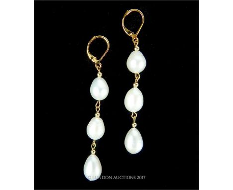 Natural AAA+ South Sea Baroque Pearl three drop earring, with 14 ct gold fittings, 6 cm long.