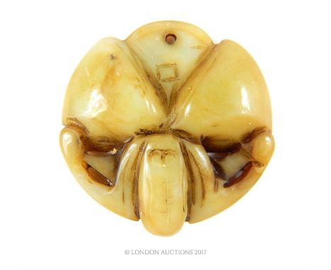 A Chinese carved jade disc form pendant, 5 x 5 x 1cm.