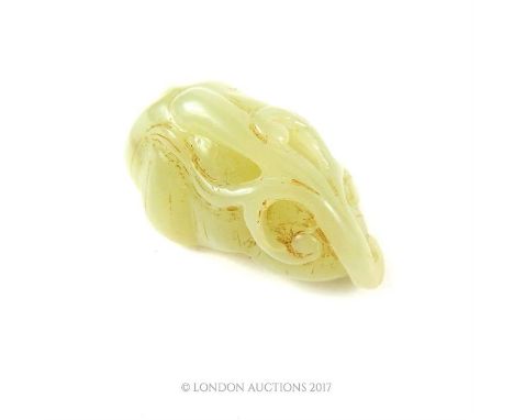 A Chinese jade carving in the form of stylised fruit, 2.5 x 4.5 x 2.5cm.