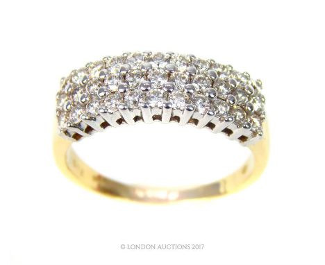 An 18 ct yellow gold diamond dress ring comprising of three horizontal rows of round, brilliant-cut diamonds in claw settings