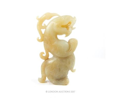 A Chinese jade carving in the form of a mythical serpent standing on it's hind feet, 8.5 x 2.5 x 5cm.