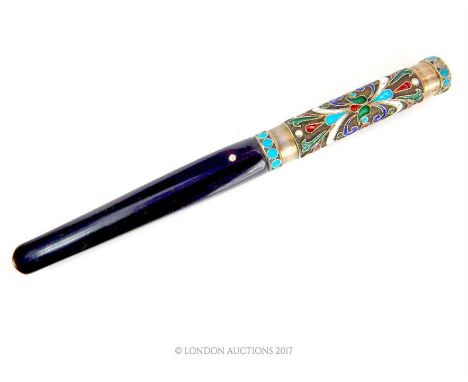 An early 20th century Russian enamel and silver cigarette holder, the handle inset with polychrome champleve enamel foilage d