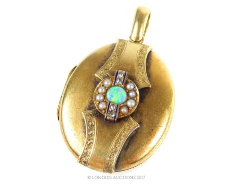 A fine, Victorian yellow gold locket centrally set with a circular opal and surrounded by a halo of seed pearls and four smal