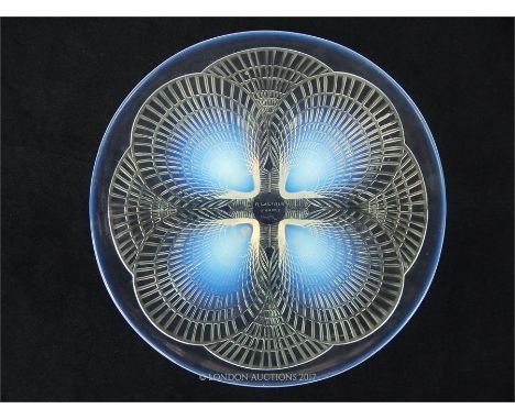 An early 20th century Rene Lalique Coquilles glass plate, featuring a design composed of four central opalescent scallop shel