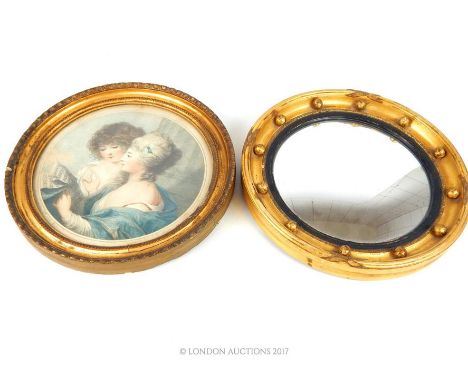 Small circular porthole mirror, gilded frame, 27 cm diameter, together with a circular framed stipple engraving of two ladies