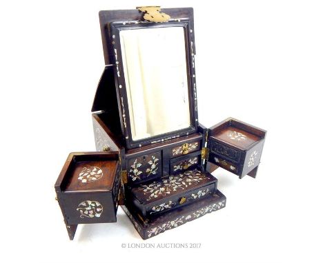 A 19th century Chinese, rosewood and mother of pearl inlaid travel dressing box, having brass handles, hinges and mounts, the