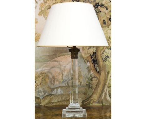 TABLE LAMP, glass column form with brass Corinthian capital and cream shade, 69cm H x 45cm W overall.