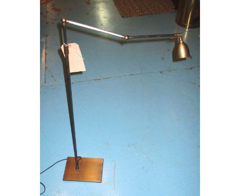 READING LIGHT, brushed metal of slender design with articulating arm in a metal finish, 150cm H extended. 