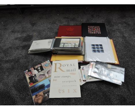 A collection of GB Presentation Packs and First Day Covers, two Rail Mail Year Packs and two Royal Mail Yearbooks along with 