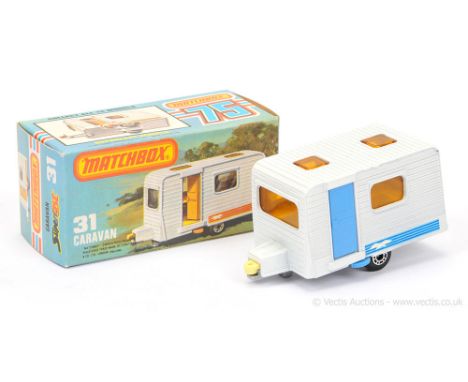 Matchbox Superfast 31c Caravan - white body with blue stripe seagull labels, light blue plastic opening door, dark amber wind