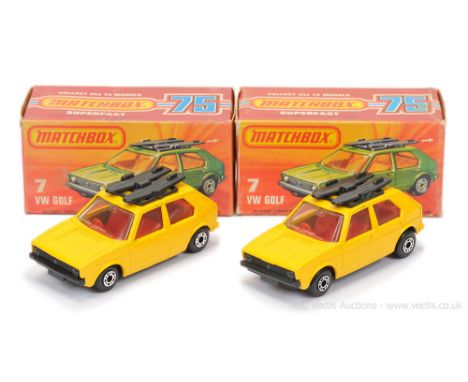 Matchbox Superfast 2 x 7c Volkswagen Golf - both are dark yellow body, clear windows, red interior - (1) gloss black base; (2