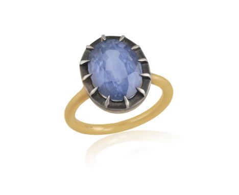 A SAPPHIRE DRESS RINGOf Georgian style, the oval-shaped sapphire weighing 5.71cts, within a multiple-claw setting, to a plain