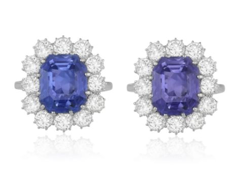 A COLOUR CHANGE SAPPHIRE AND DIAMOND CLUSTER RINGThe cut-cornered rectangular sapphire weighing 6.29cts, within a multiple-cl