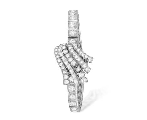 A LADY'S DIAMOND COCKTAIL SECRET WATCH, CIRCA 1955The 10-jewel manual wind movement, with central hinged motif of scrolled un