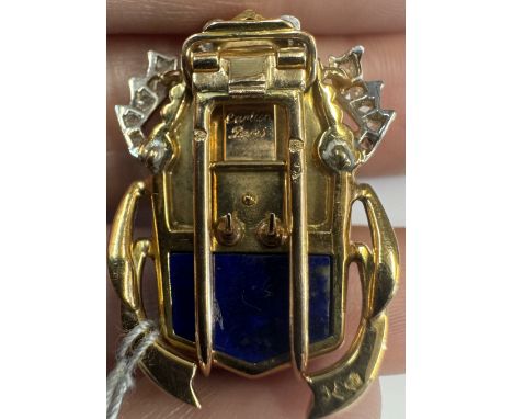 CARTIER: A RARE AND COLLECTIBLE LAPIS LAZULI, TURQUOISE AND DIAMOND NOVELTY CLIP BROOCH, CIRCA 1945The stylised scarab, with 