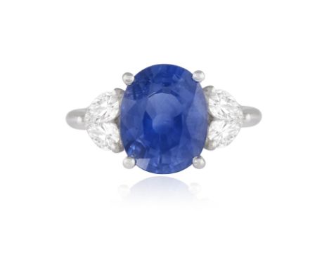 A SAPPHIRE AND DIAMOND RING  Claw-set with a sapphire weighing approximately 4.60cts, between pear-shaped diamond shoulders s