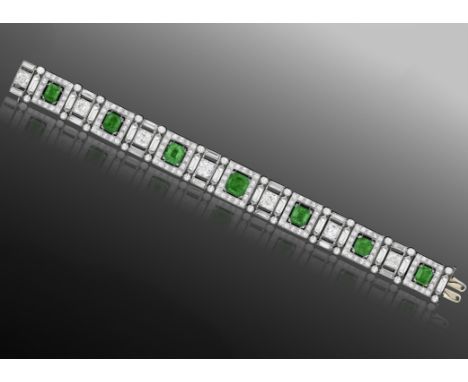  AN IMPORTANT ART DECO EMERALD AND DIAMOND BRACELET, CIRCA 1925Of openwork design, the series of square-shaped links pavé-set