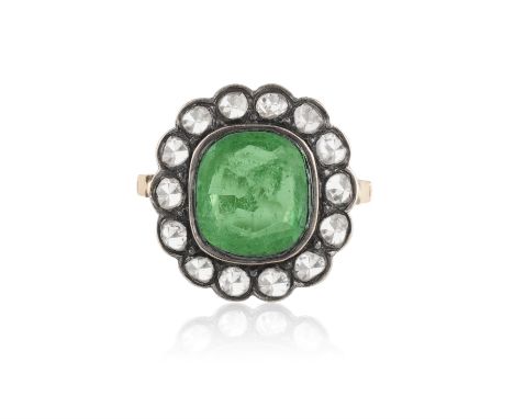 A 19TH CENTURY EMERALD AND DIAMOND DRESS RING, SECOND HALF OF THE CENTURYThe collet-set cushion-shaped emerald weighing appro
