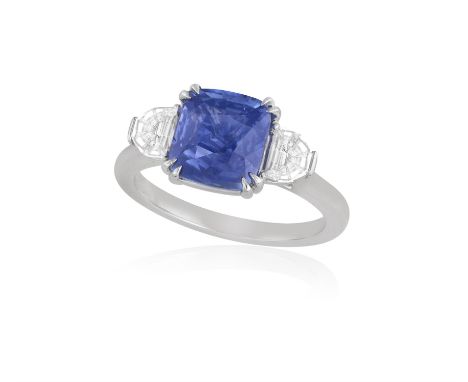 A SAPPHIRE AND DIAMOND RINGThe cushion-shaped sapphire weighing 3.01cts, between a double four-claw setting, to half moon-sha