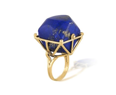A GOLD AND LAPIS LAZULI COCKTAIL RINGThe openwork wire mount highlighted by beads and scrolled shoulder detailing, set with a