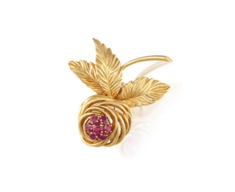 VAN CLEEF AND ARPELS: A RUBY BROOCH, CIRCA 1955The stylised rose flower, embellished with circular-cut ruby pistil, to textur