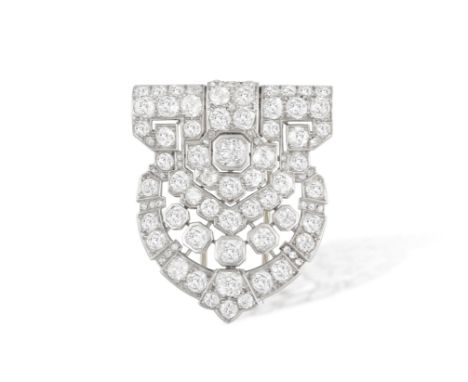  AN ART DECO DIAMOND CLIP BROOCH, FRENCH, CIRCA 1925-30The shield-shaped openwork plaque, centrally set with old-cut diamonds