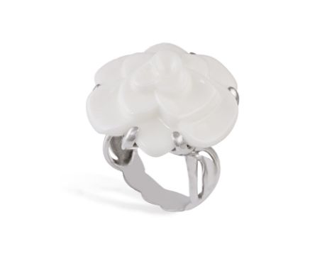 CHANEL: AN AGATE 'CAMÉLIA' DRESS RINGSet with a cacholong agate, carved as a camellia flowerhead to a mount of foliate design