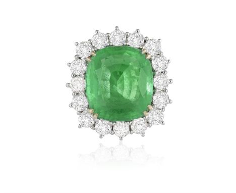AN EMERALD AND DIAMOND CLUSTER RINGThe cushion-shaped emerald, weighing approximately 8.80cts, within a double four-claw sett