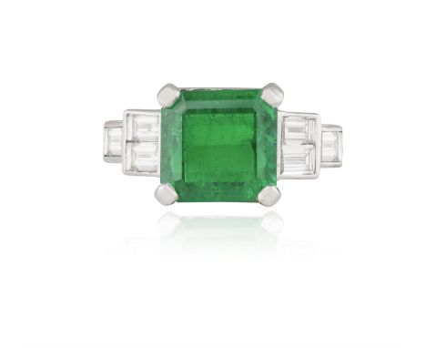 AN EMERALD AND DIAMOND DRESS RINGThe cut-cornered step-cut emerald weighing approximately 4.70cts, within a four-claw setting