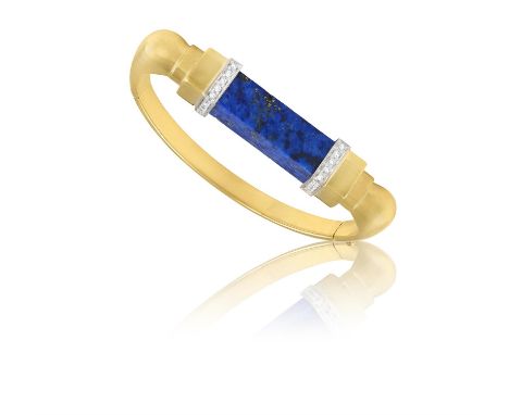 MARCHISIO: A LAPIS LAZULI AND DIAMOND BANGLE, CIRCA 1968The hinged bangle centring a lapis lazuli baton, between single-cut d