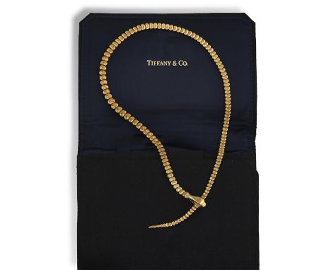TIFFANY & CO., DESIGNED BY ELSA PERETTI: A GOLD 'SNAKE' NECKLACEThe articulating graduated 'bean' links, finishing with a pol