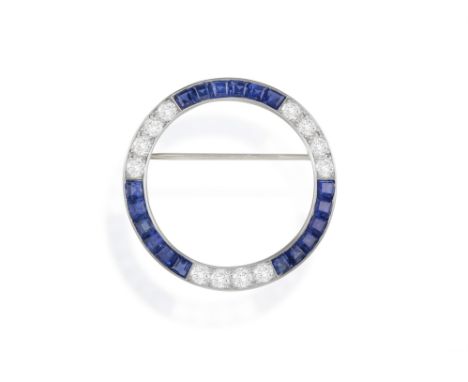 TIFFANY & CO. : AN EARLY 20TH CENTURY SAPPHIRE AND DIAMOND BROOCH, CIRCA 1920Of openwork circular design, set with a series o
