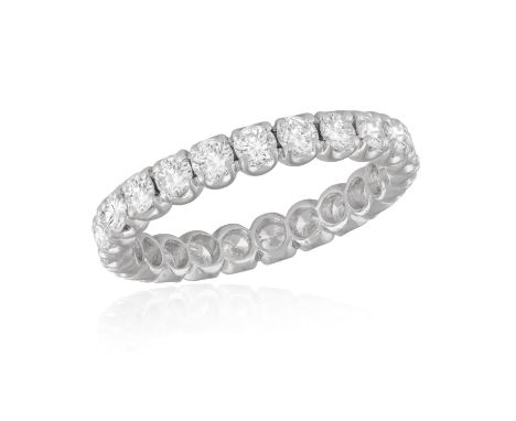 A DIAMOND ETERNITY RINGComposed of a continuous row of brilliant-cut diamonds, mounted in 18K gold, diamonds approximately 1.