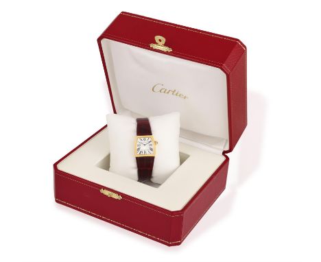 CARTIER: AN 18K GOLD 'LA DONA' WRISTWATCH, CIRCA 2007Of quartz movement, the silvered guilloche asymmetrical tonneau-shaped d