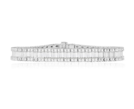 A DIAMOND BRACELETComposed of a continuous row of baguette-cut diamonds at the centre, between borders of brilliant-cut diamo
