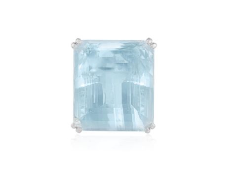 AN AQUAMARINE DRESS RING, FRENCH, FIRST QUARTER OF THE CENTURYThe raised cut-cornered rectangular aquamarine, weighing approx