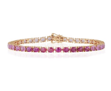 A PINK SAPPHIRE LINE BRACELETComposed of a continuous row of oval-shaped sapphires of graduated pink hues, mounted in 18K ros