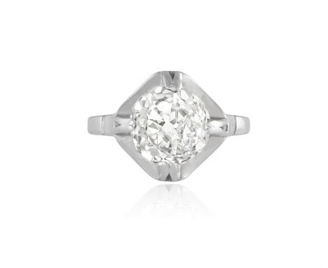 A DIAMOND SINGLE-STONE RING, CIRCA 1960The raised old brilliant-cut diamond weighing approximately 2.55cts, within a double f