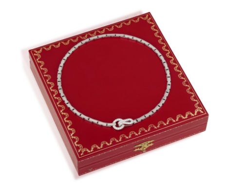 CARTIER: A DIAMOND 'AGRAFE' NECKLACEComposed of a fancy-link chain, centring a hook-and-loop clasp pavé-set with brilliant-cu