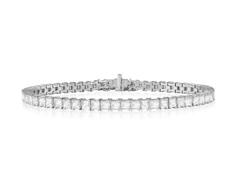 A DIAMOND LINE BRACELETComposed of a continuous line of princess-cut diamonds without claw-setting, mounted in platinum, with