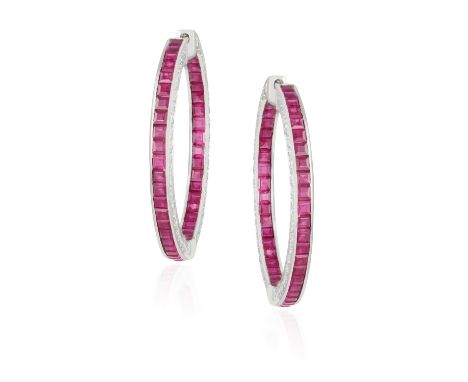 A PAIR OF RUBY AND DIAMOND HOOP EARRINGSEach hoop channel-set to the front and reverse with calibré-cut rubies, edges pave-se