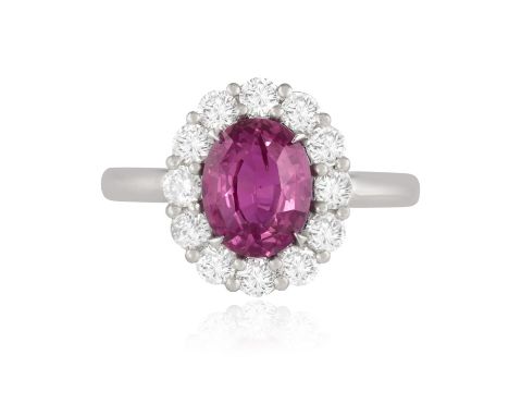 A PINK SAPPHIRE AND DIAMOND CLUSTER RINGCentrally set with an oval-shaped pink sapphire weighing 2.04cts, within a four-claw 