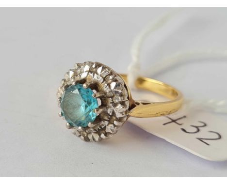 A blue zircon ring with diamond shoulders 18ct gold size K      4.2 gms 