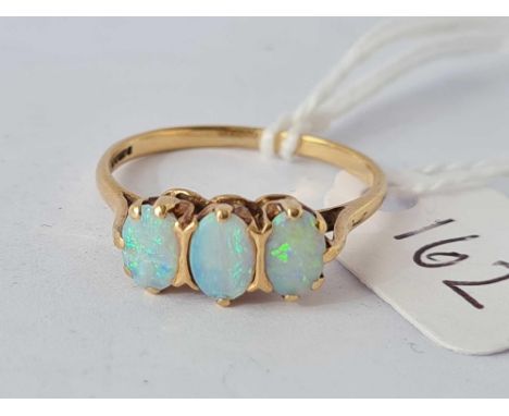 A three stone opal ring 9ct (stones rubbed small chip) size P      1.8 gms 