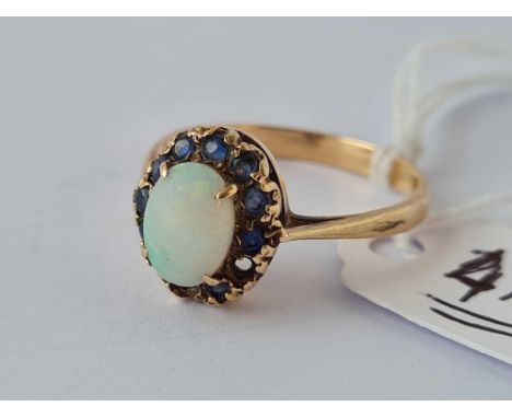 A opal and sapphire ring ( one stone missing ) 9ct size S      3 gms 