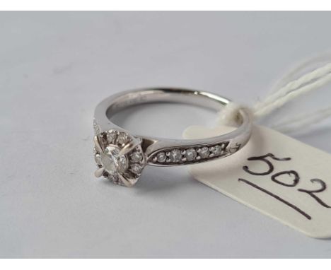 A multi diamond set 9ct white gold ring with diamond shoulders size K 2.8g inc