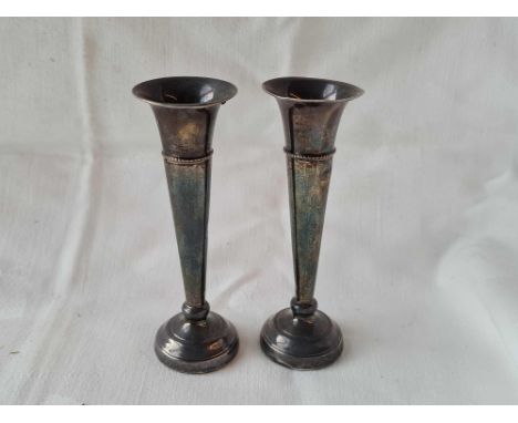 A pair of spill vases, 4.5" high, Birmingham 1957 and a napkin ring unmarked